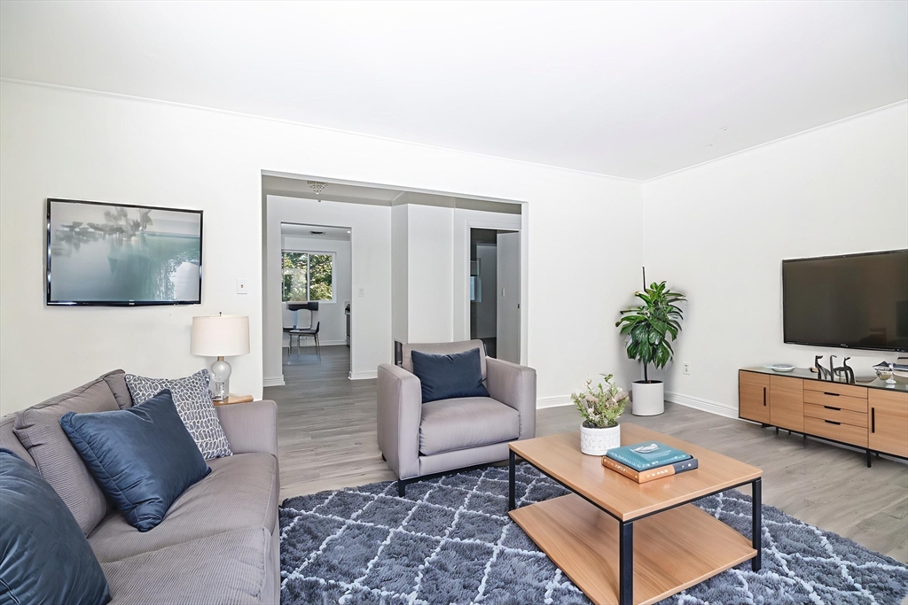 41 Bayberry Drive, Unit 4 Sharon, MA 02067 - Photo 4 of 27 a living room with furniture and a flat screen tv