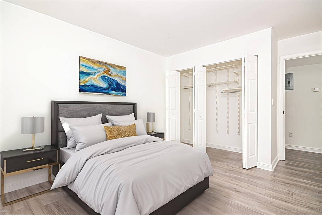 41 Bayberry Drive, Unit 4 Sharon, MA 02067 - Photo 5 of 27 a bedroom with a bed and a painting on the wall