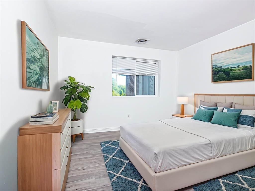 41 Bayberry Drive, Unit 4 Sharon, MA 02067 - Photo 6 of 27 a bedroom with a bed and a window