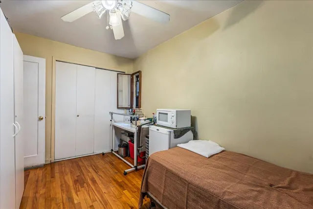 a bed room with a bed and a chandelier