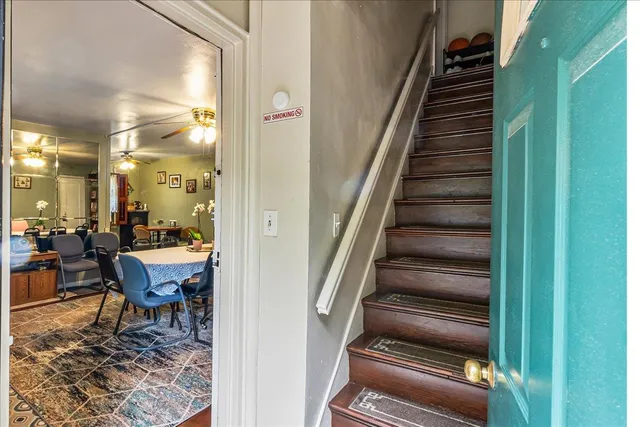 a view of a hallway with chairs