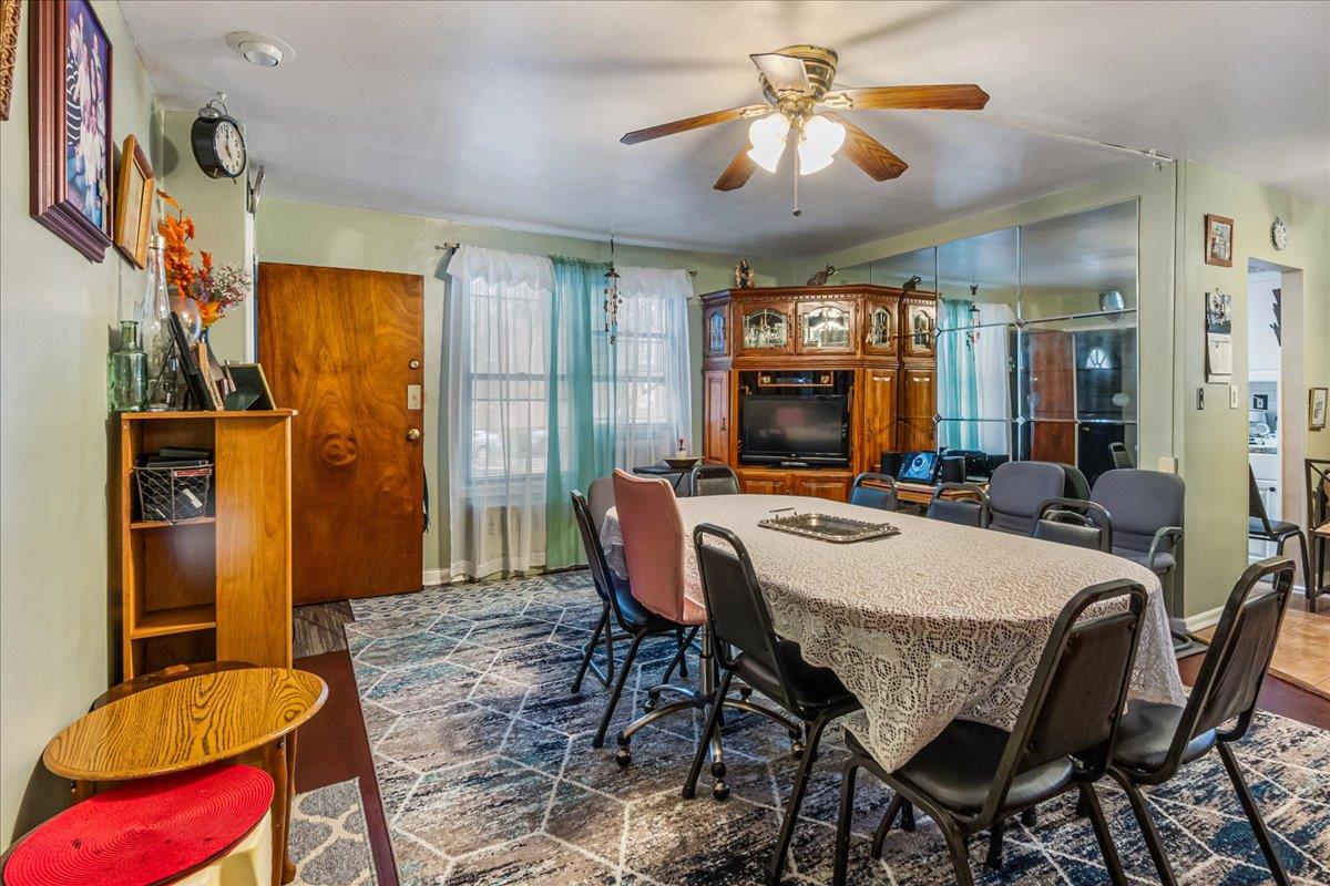196-66 67th Avenue, Unit 1 Queens, NY 11365 - Photo 6 of 19 a view of a dining room with furniture and chandelier