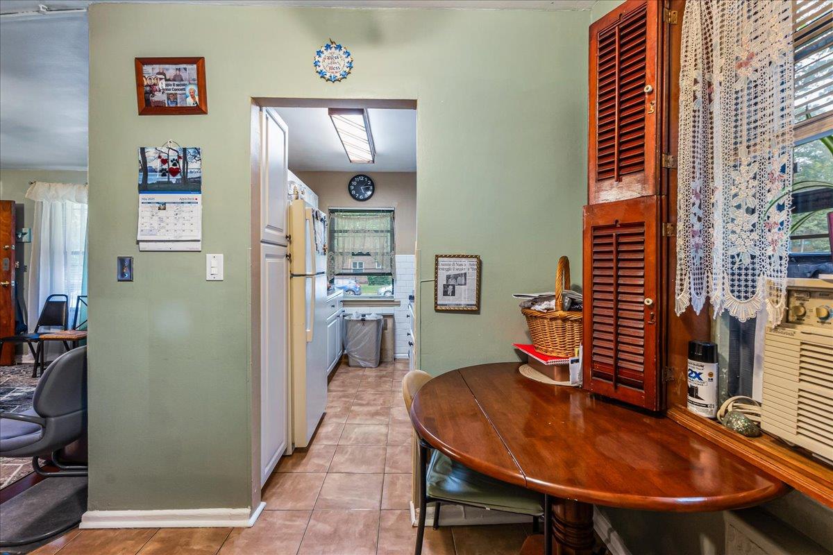 196-66 67th Avenue, Unit 1 Queens, NY 11365 - Photo 9 of 19 a dining room with furniture and wooden floor