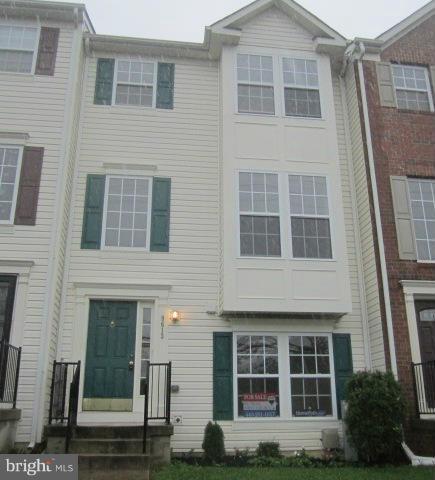 9613 Bird River Road Baltimore, MD 21220 - Photo 1 of 20 a front view of a house with a yard