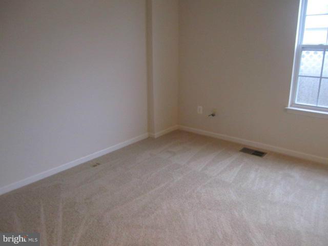 9613 Bird River Road Baltimore, MD 21220 - Photo 11 of 20 an empty room with a window