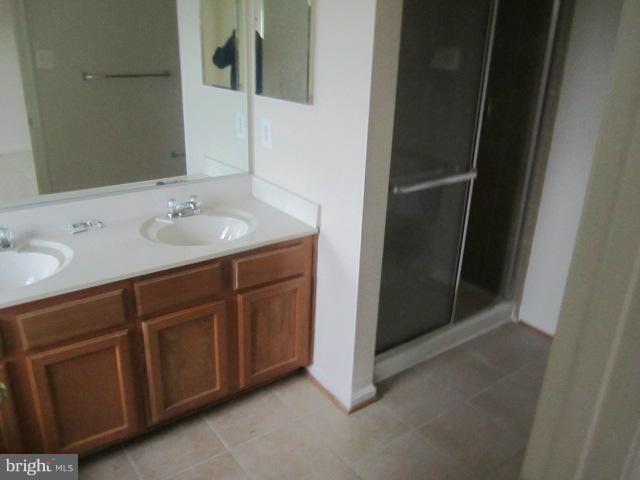 9613 Bird River Road Baltimore, MD 21220 - Photo 15 of 20 a bathroom with a sink and mirror