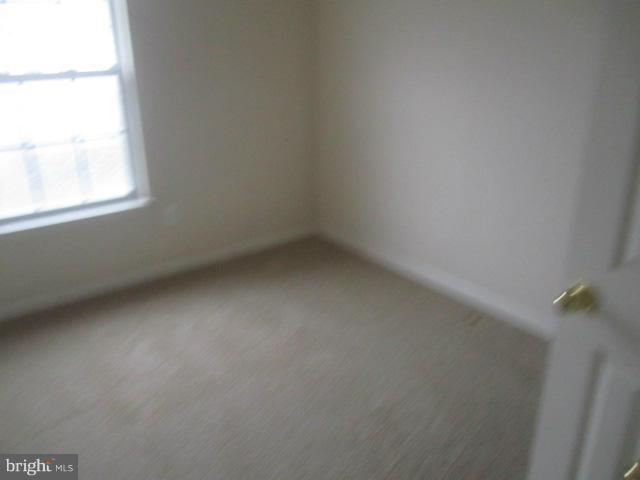 9613 Bird River Road Baltimore, MD 21220 - Photo 16 of 20 an empty room with a window