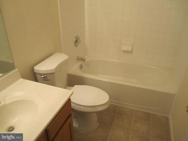 9613 Bird River Road Baltimore, MD 21220 - Photo 17 of 20 a bathroom with a sink a toilet and shower