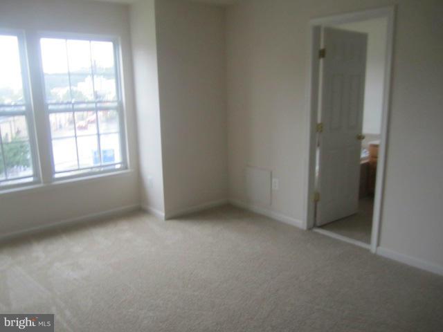9613 Bird River Road Baltimore, MD 21220 - Photo 19 of 20 an empty room with windows and closet
