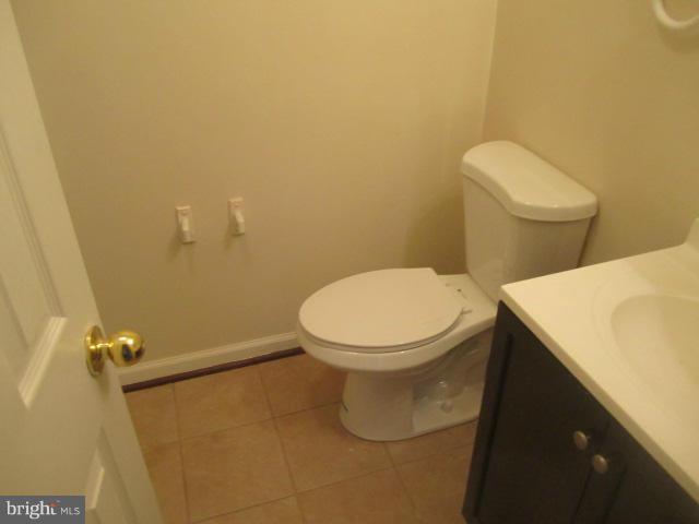 9613 Bird River Road Baltimore, MD 21220 - Photo 6 of 20 a bathroom with a toilet and a sink