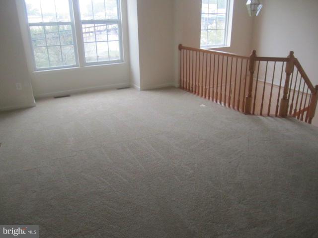 9613 Bird River Road Baltimore, MD 21220 - Photo 8 of 20 an empty room with windows