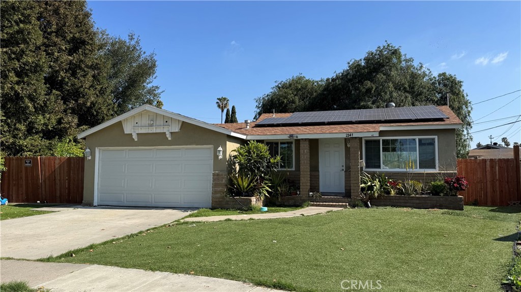 2341 Lewis Street Santa Ana, CA 92706 - Photo 1 of 1 a front view of a house with a yard