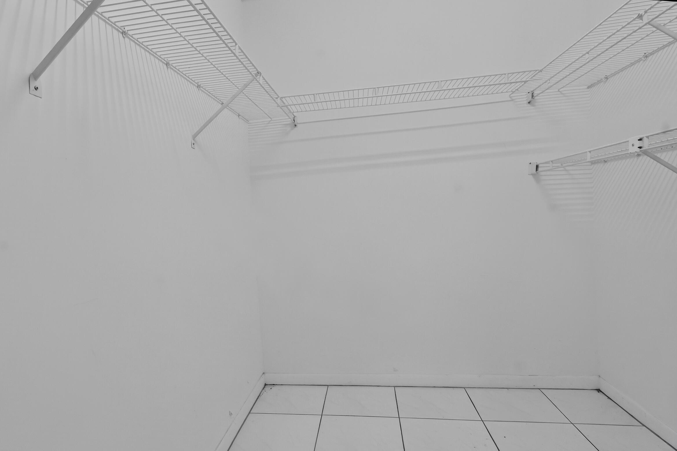 6065 Sunny Manor Court Delray Beach, FL 33484 - Photo 19 of 58 a view of a rack on the wall