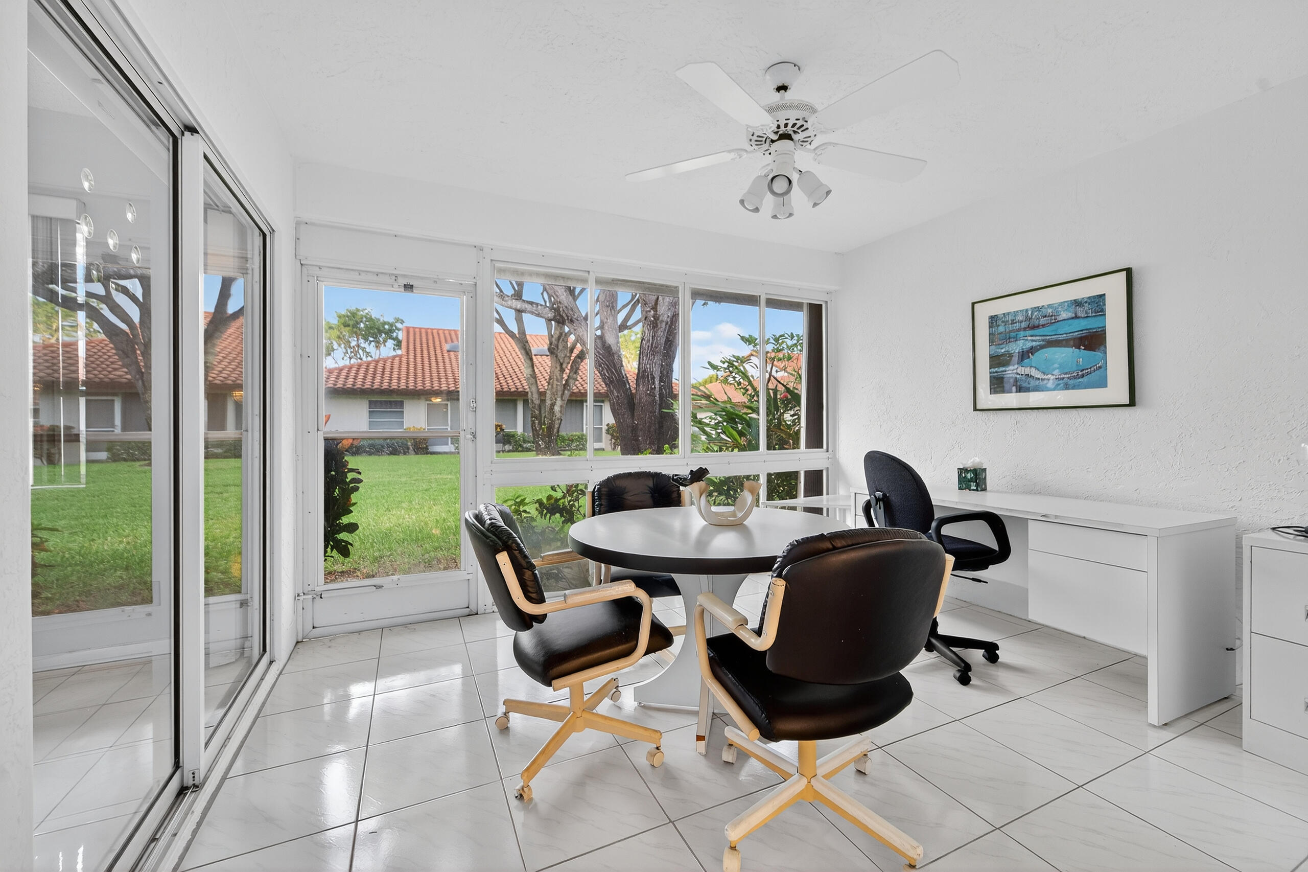 6065 Sunny Manor Court Delray Beach, FL 33484 - Photo 20 of 58 a work room with furniture and a floor to ceiling window