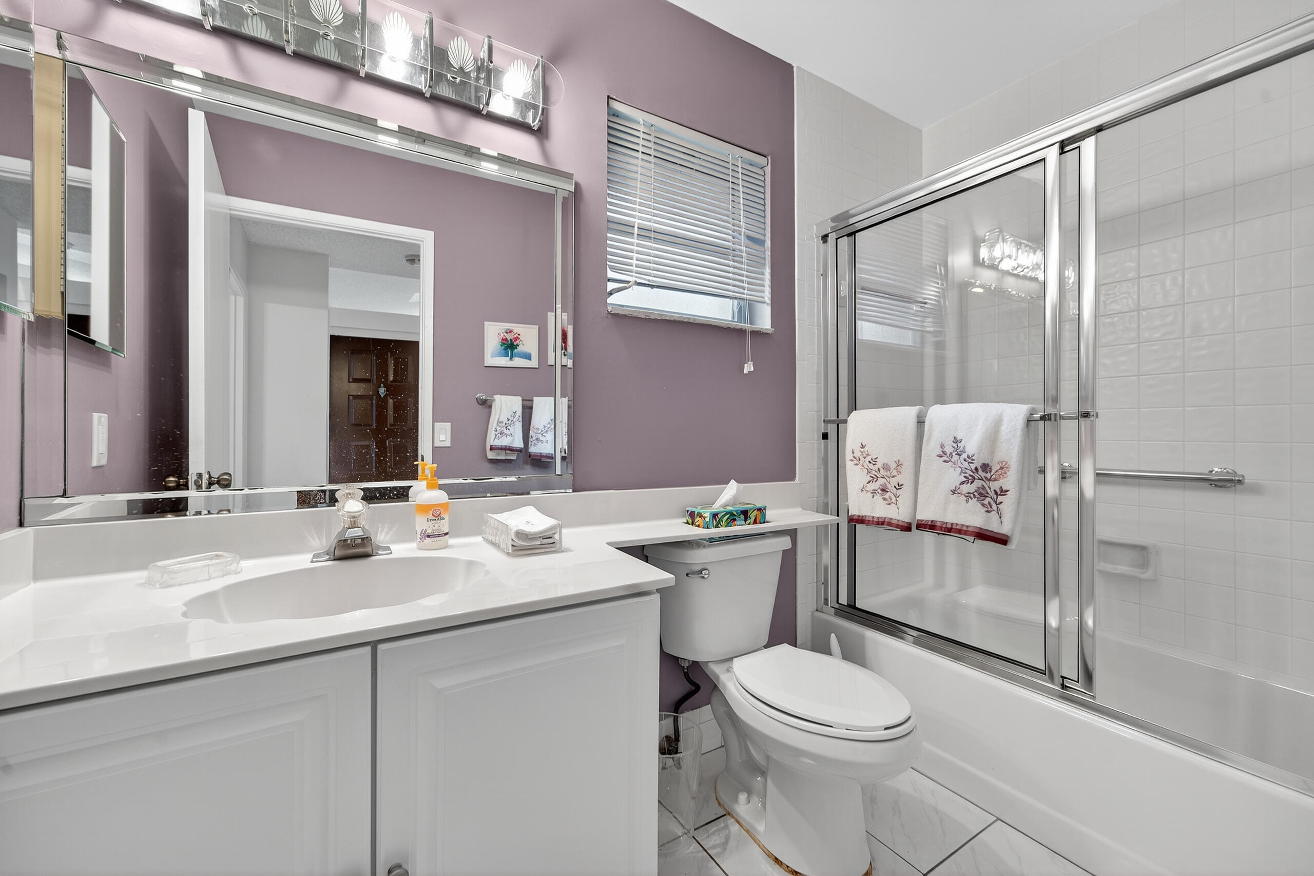 6065 Sunny Manor Court Delray Beach, FL 33484 - Photo 22 of 58 a bathroom with a sink toilet and shower