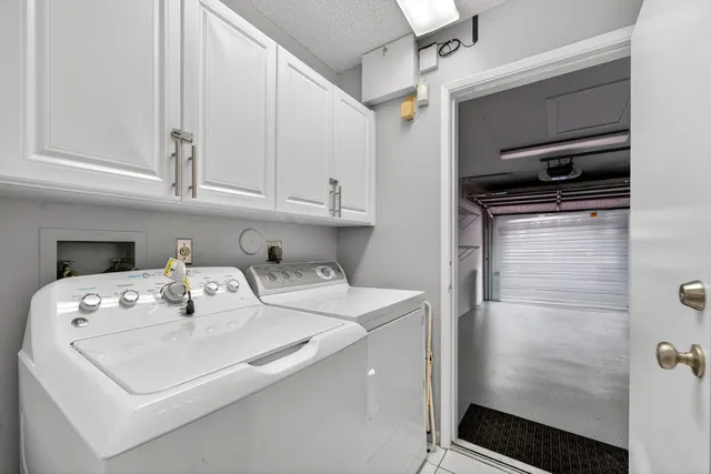 a view of water heater room with a ceiling fan