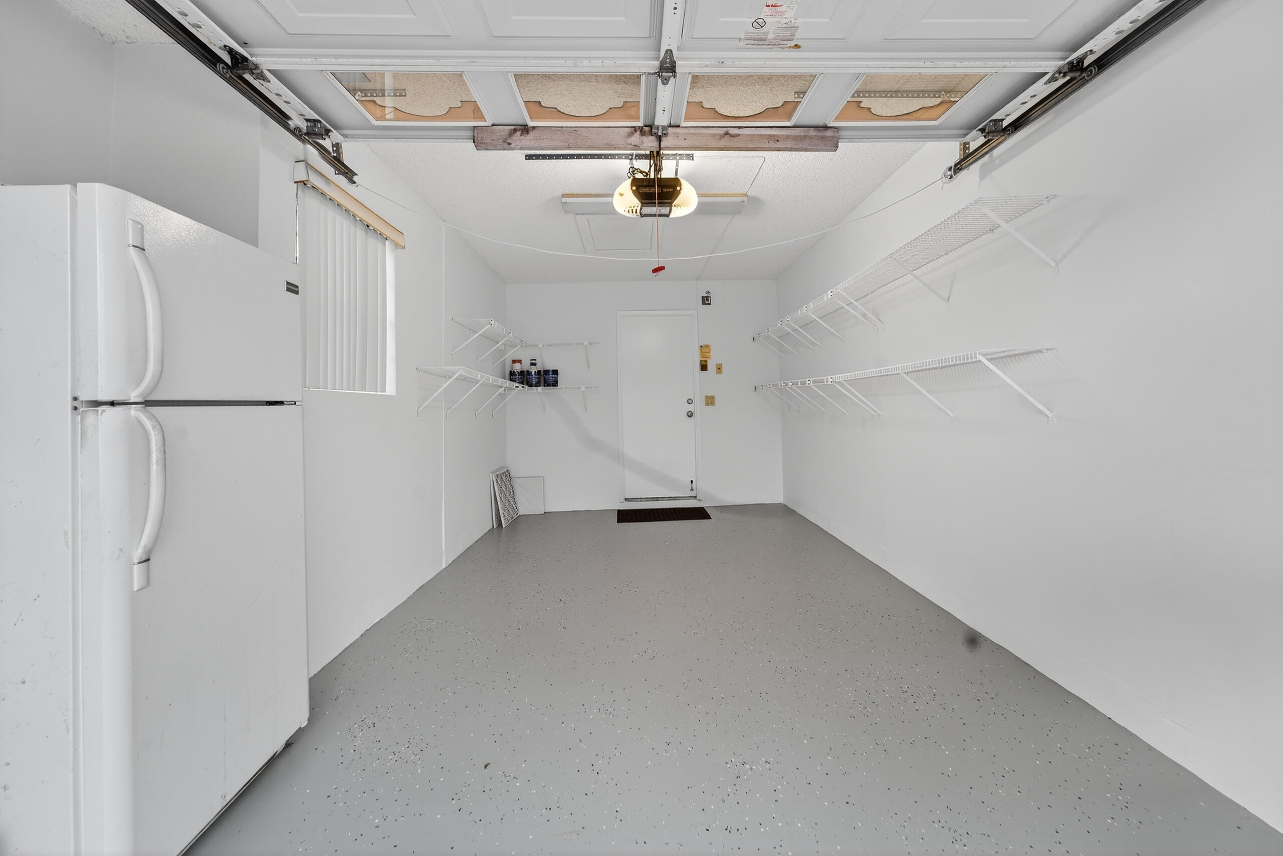 6065 Sunny Manor Court Delray Beach, FL 33484 - Photo 26 of 58 a view of water heater room with a ceiling fan