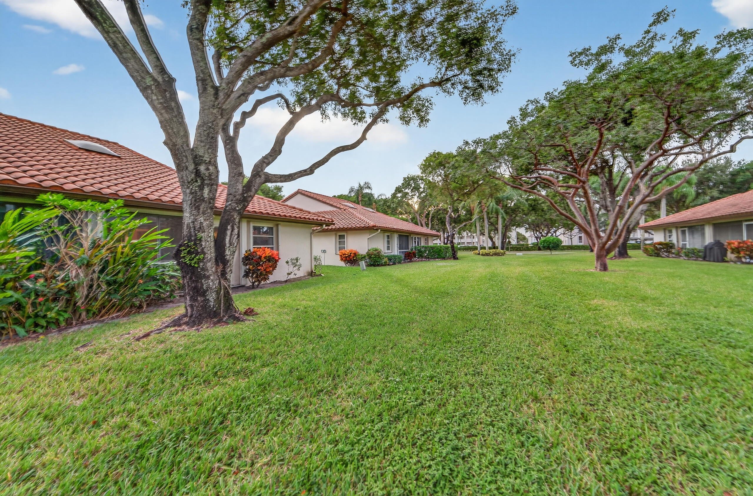6065 Sunny Manor Court Delray Beach, FL 33484 - Photo 32 of 58 a front view of house with a garden