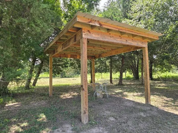 a view of a house with backyard from a patio