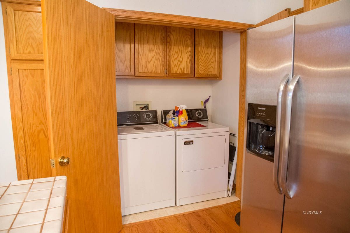 26540 Saunders Meadow Road Idyllwild, CA 92549 - Photo 13 of 34 a kitchen with a refrigerator and cabinets