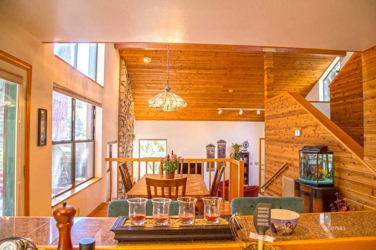 26540 Saunders Meadow Road Idyllwild, CA 92549 - Photo 14 of 34 a view of a living room with a floor to ceiling window and floor to ceiling window