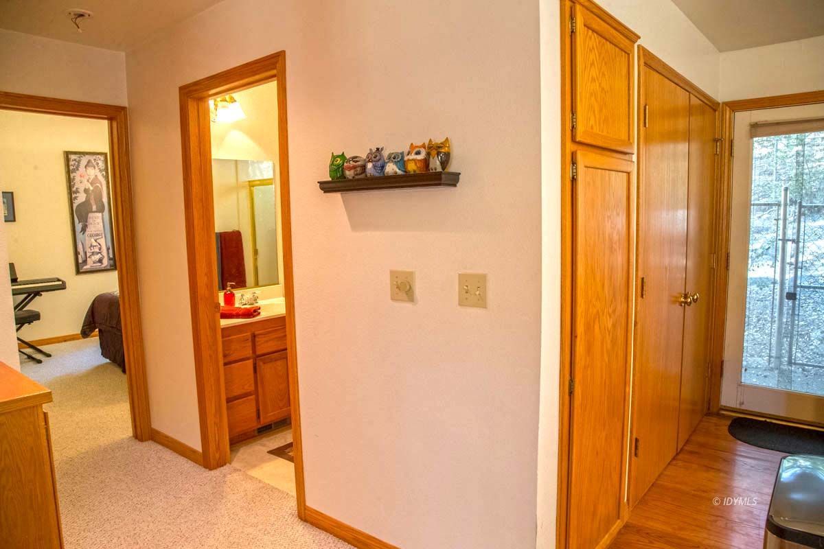 26540 Saunders Meadow Road Idyllwild, CA 92549 - Photo 15 of 34 a view of a bedroom with wooden floor and a window