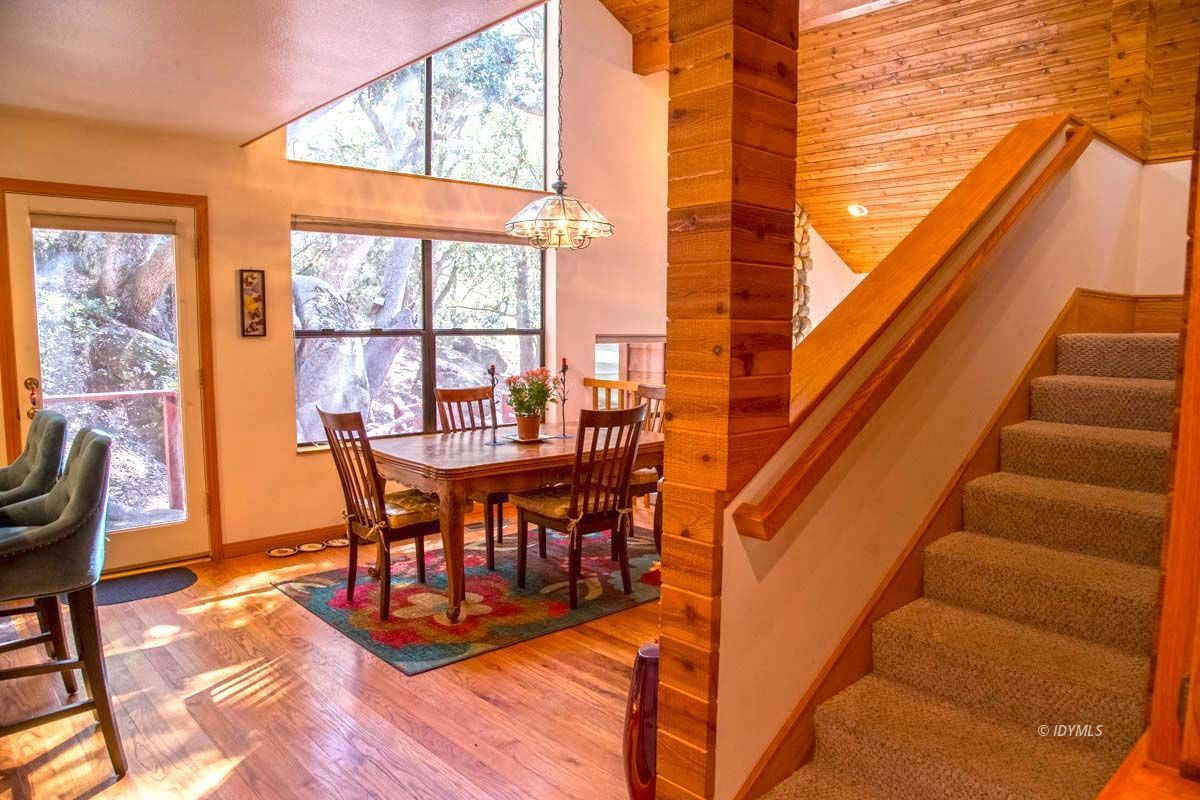 26540 Saunders Meadow Road Idyllwild, CA 92549 - Photo 18 of 34 a view of a dining room with furniture window and outside view