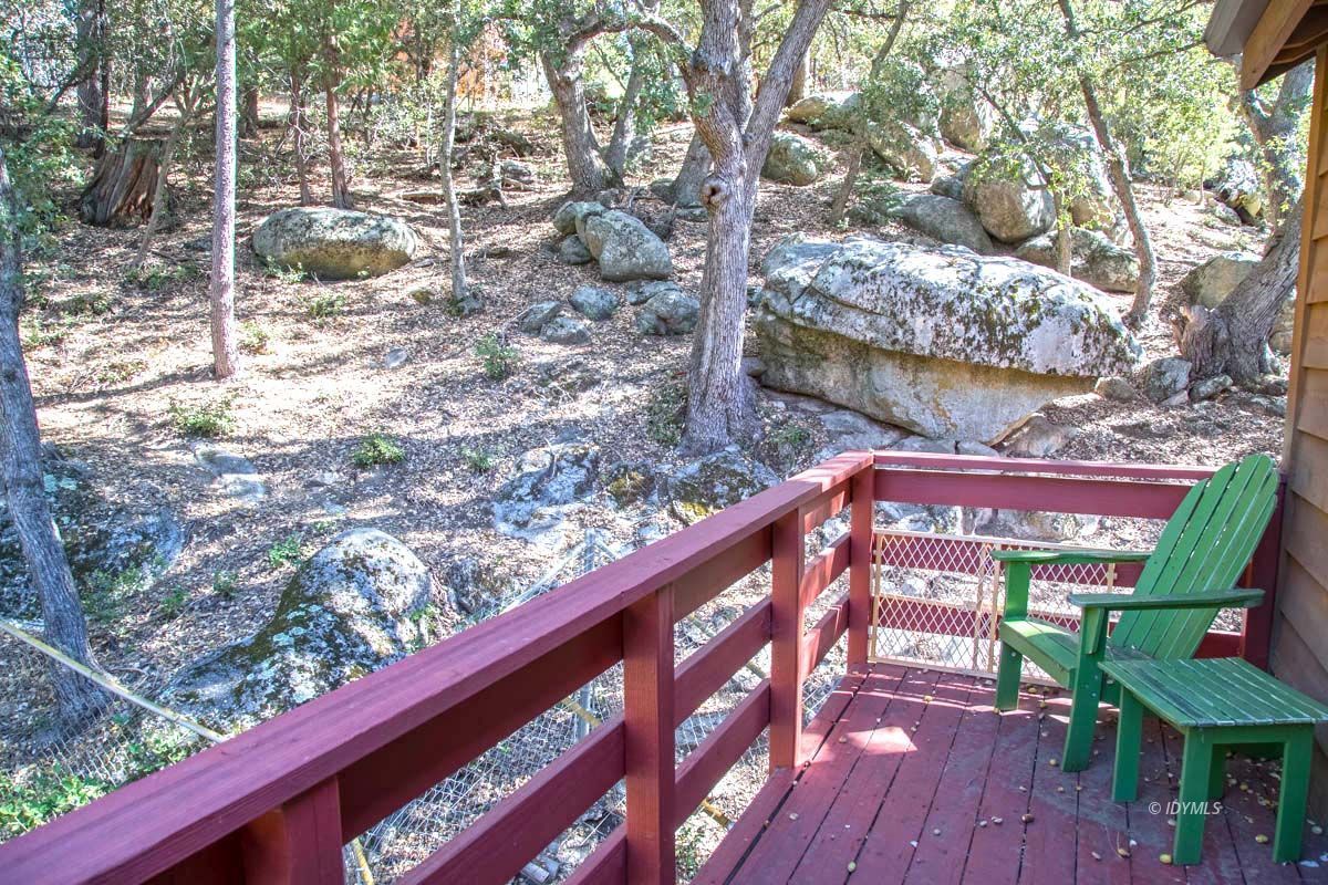 26540 Saunders Meadow Road Idyllwild, CA 92549 - Photo 24 of 34 a view of a wooden chairs in a patio