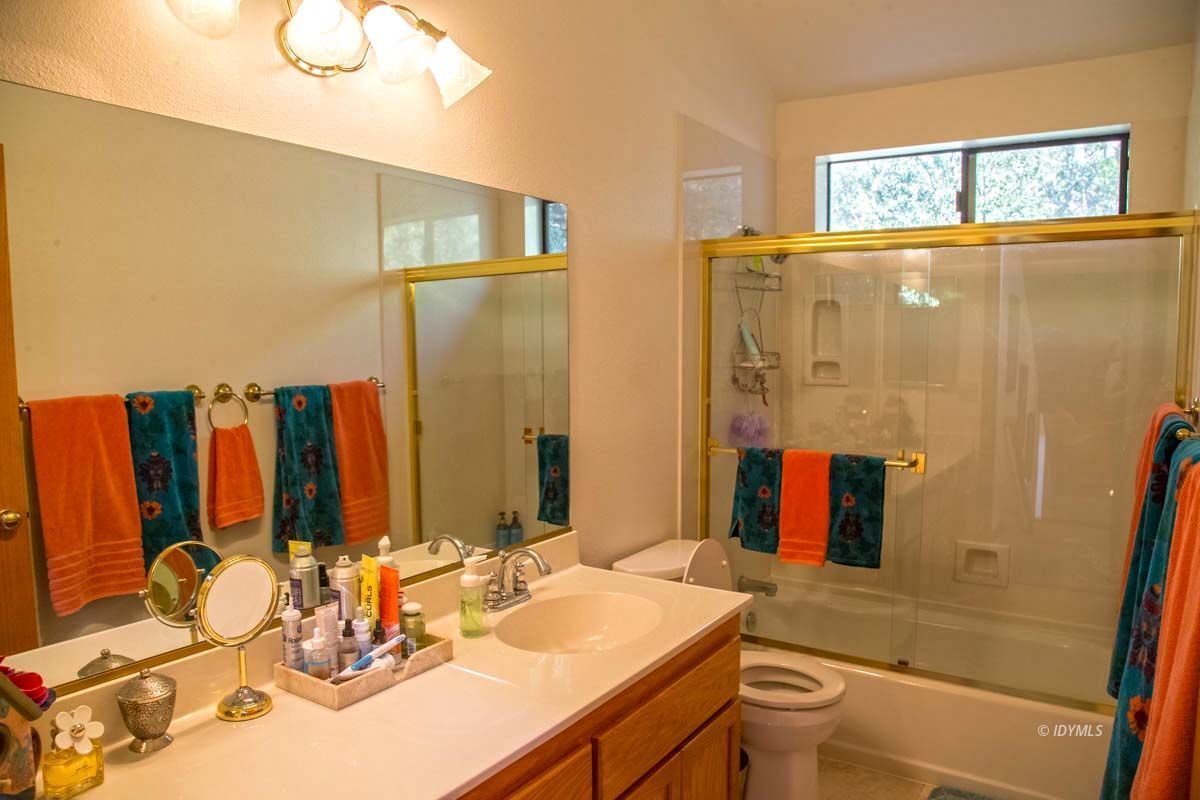 26540 Saunders Meadow Road Idyllwild, CA 92549 - Photo 26 of 34 a bathroom with a sink a toilet and shower