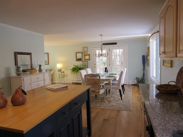 33 Russell Road Mashpee, MA 02649 - Photo 6 of 22 a view of a dining room with furniture and wooden floor