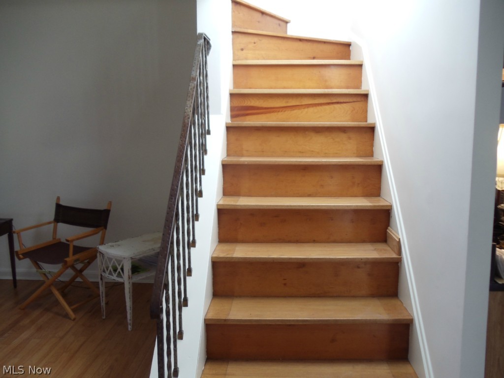 980 East Green Road Cleveland, OH 44121 - Photo 5 of 25 STAIRS ARE FINISHED AND EASY ACCESS TO THE SECOND FLOOR AREA.