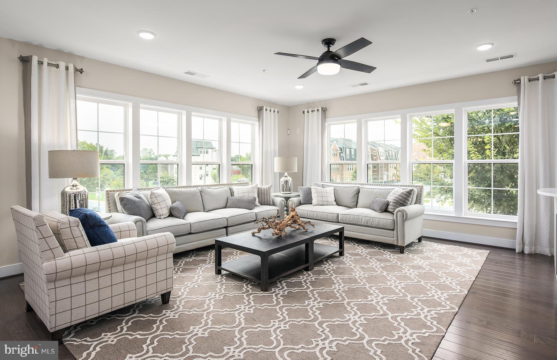 2319 Field Point Road, Unit 20101 Herndon, VA 20171 - Photo 7 of 22 Sunlit Gathering Room with Hardwood Flooring