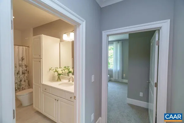a view of a house with backyard and porch