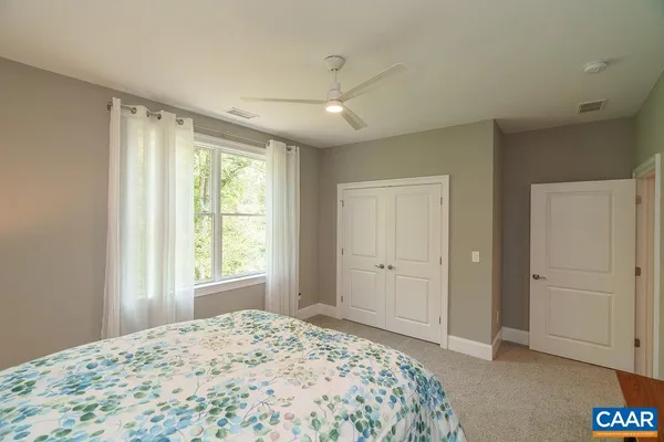 a view of a house with a backyard and garage