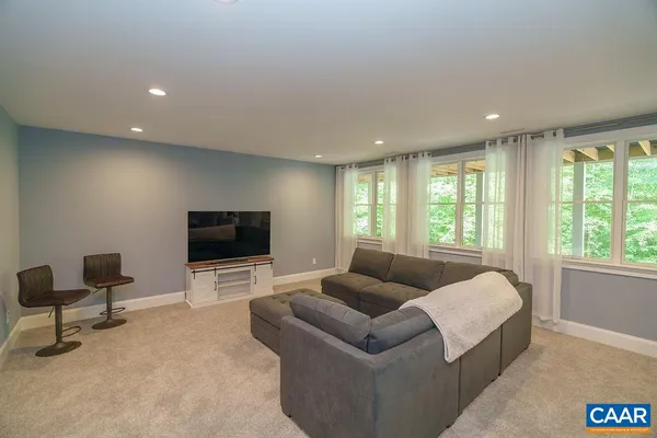 an aerial view of a house with a garden and trees