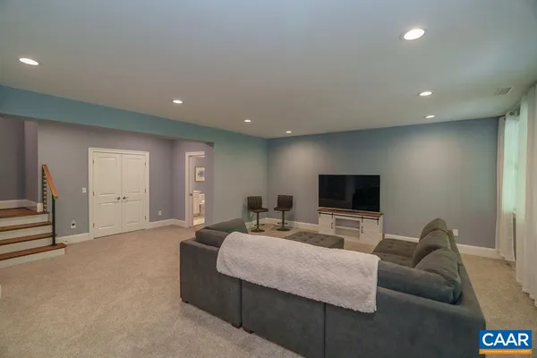 a view of a lush green forest with trees and some houses