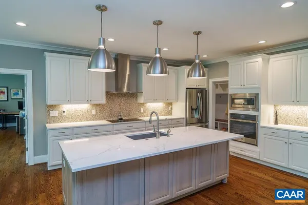 a living room with furniture a rug and a fireplace