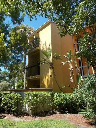 a front view of house with yard and outdoor seating