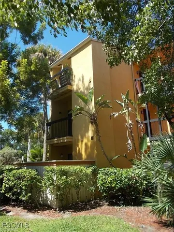 a front view of house with yard and outdoor seating
