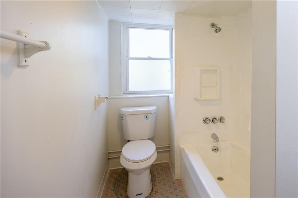 3226 Richardson Avenue Pittsburgh, PA 15212 - Photo 2 of 6 a bathroom with a toilet and a bathtub
