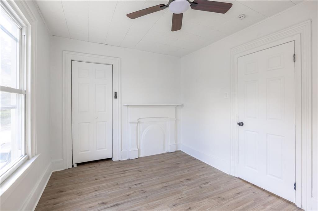3226 Richardson Avenue Pittsburgh, PA 15212 - Photo 3 of 6 wooden floor in an empty room with a window