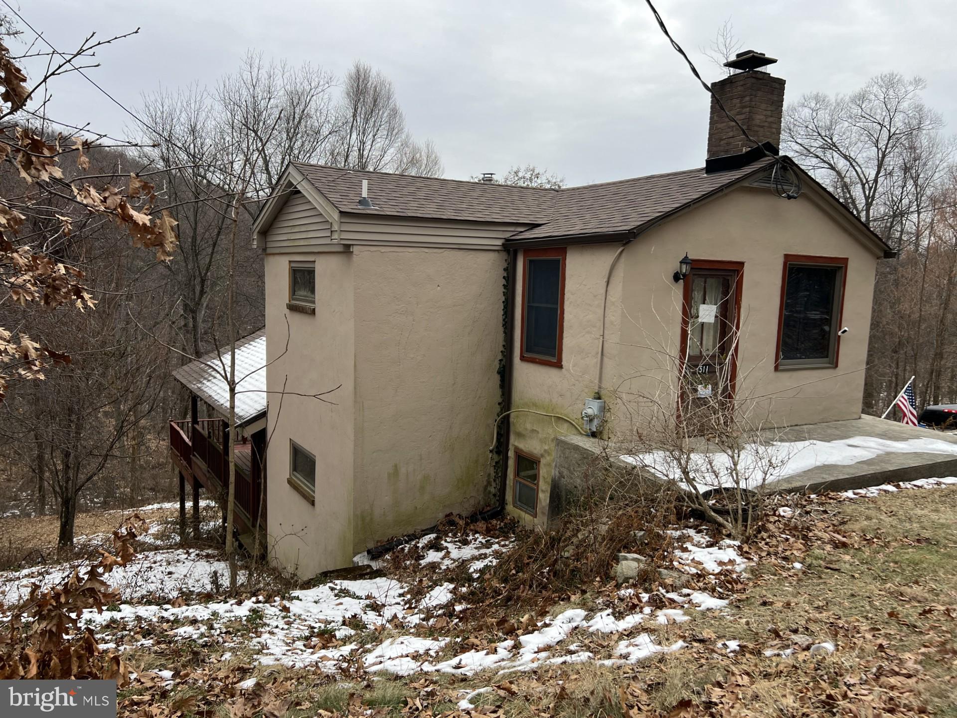 511 Church Lane Road Reading, PA 19606 - Photo 3 of 17 a view of a house with snow on the wall