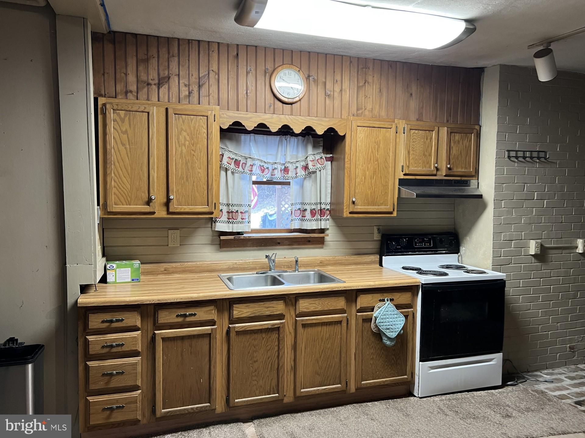511 Church Lane Road Reading, PA 19606 - Photo 8 of 17 a kitchen with stainless steel appliances granite countertop a sink a stove and a microwave