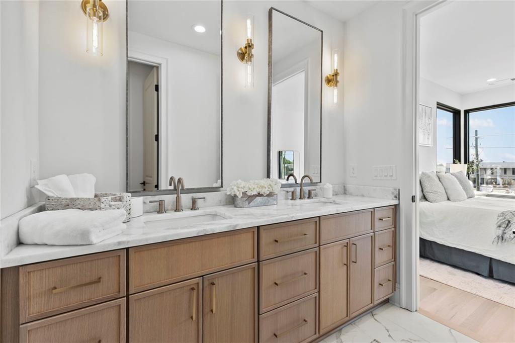 1962 8th Street, Unit 5 Chamblee, GA 30341 - Photo 38 of 57 a bathroom with double vanity sinks and a mirror