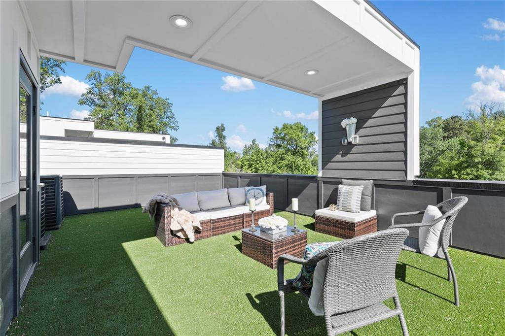 1962 8th Street, Unit 5 Chamblee, GA 30341 - Photo 42 of 57 a patio with table and chairs