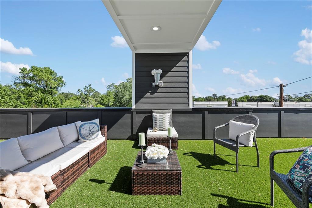 1962 8th Street, Unit 5 Chamblee, GA 30341 - Photo 47 of 57 a view of a patio with couches chairs and a yard