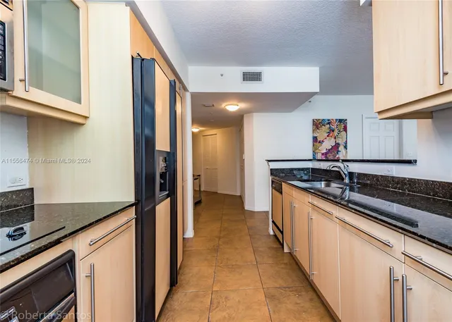 a bathroom with a sink toilet and mirror