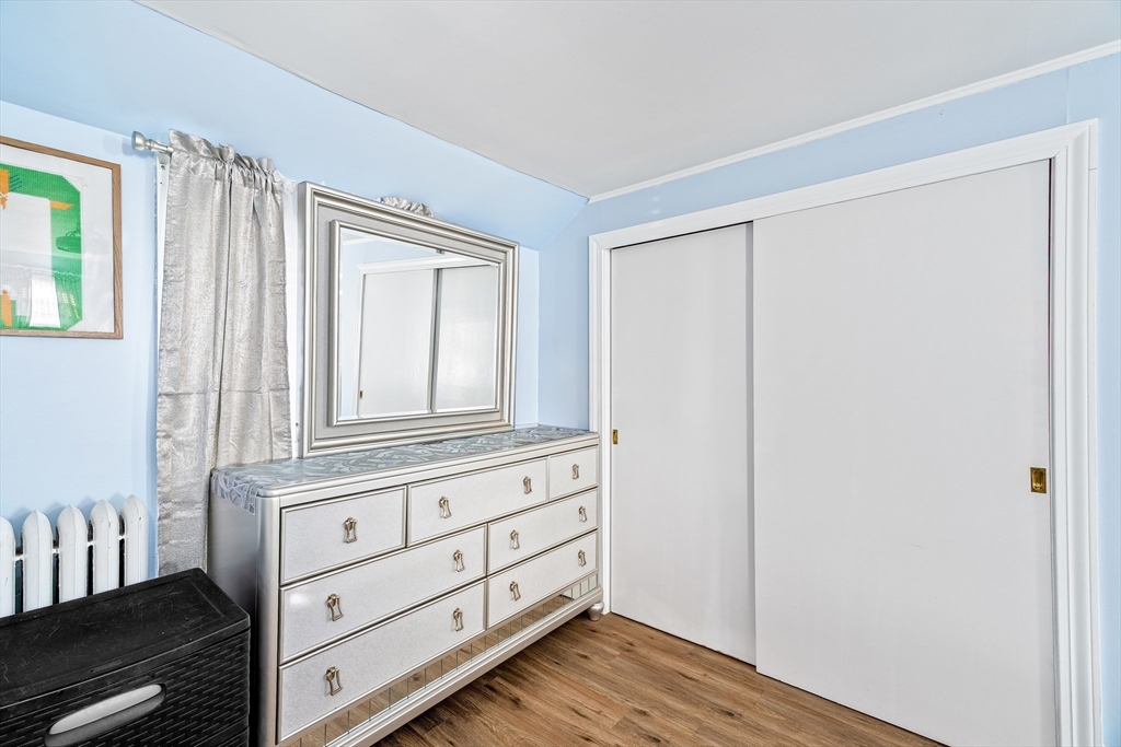 28 Maple Street Southbridge, MA 01550 - Photo 17 of 25 a room with wooden floor and cabinet