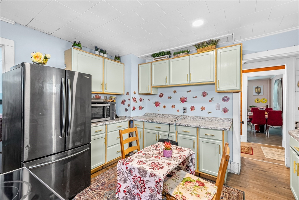 28 Maple Street Southbridge, MA 01550 - Photo 20 of 25 a kitchen with stainless steel appliances granite countertop a refrigerator and a stove top oven