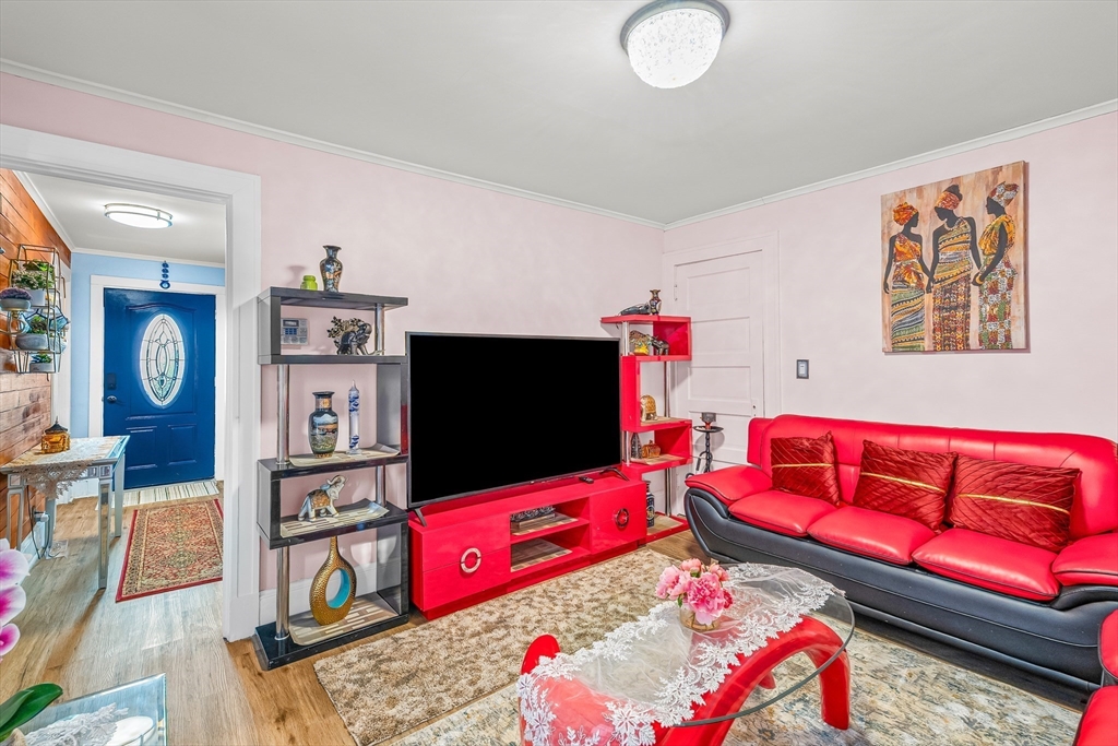 28 Maple Street Southbridge, MA 01550 - Photo 5 of 25 a living room with furniture and a flat screen tv